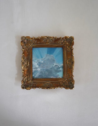 miniature painting of clouds with silver lining against blue sky set in ornate gold frame